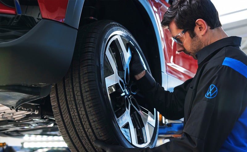 Mechanic checking tires image